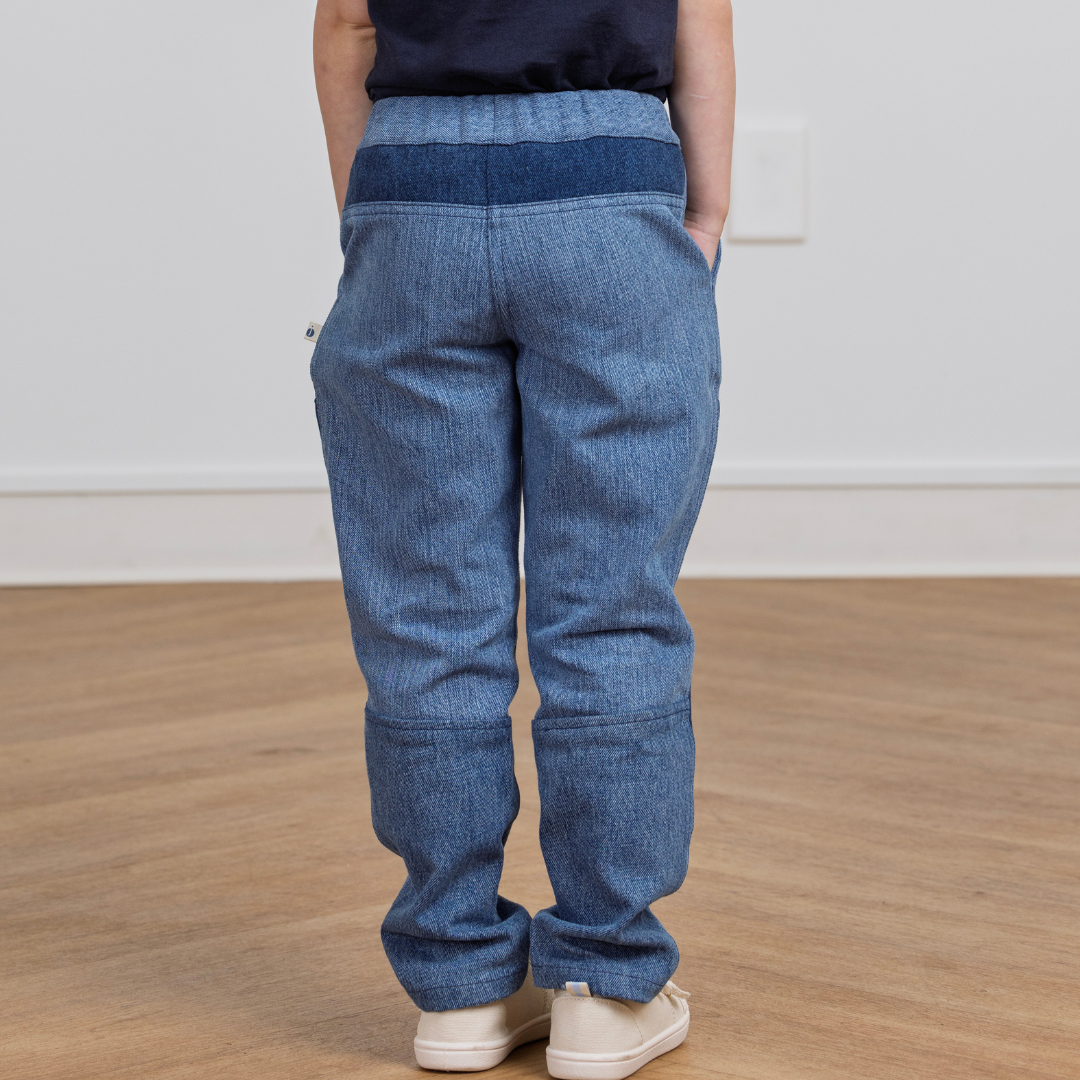 Kids' blue denim-style pants with elastic waist, back view, sustainable active wear