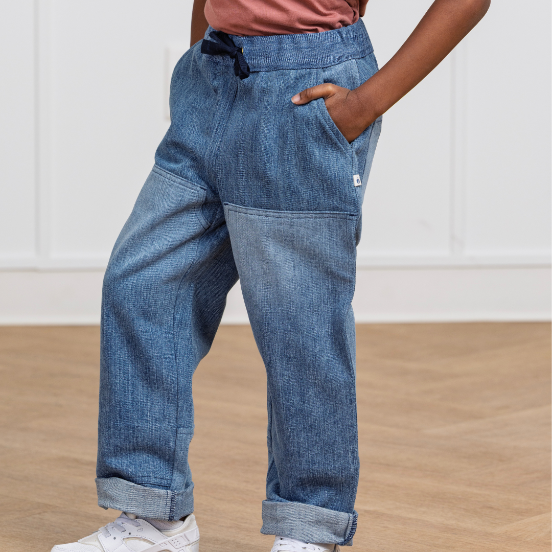 Kids' blue denim joggers with drawstring waist, side pockets, and cuffed hems for active play
