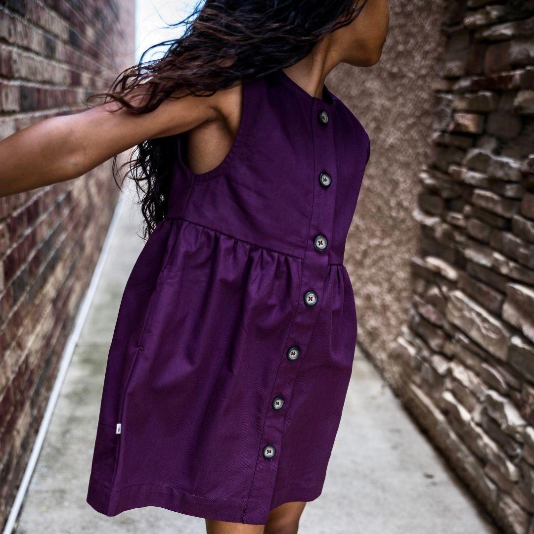 Cropped photo of a girl wearing purple dress