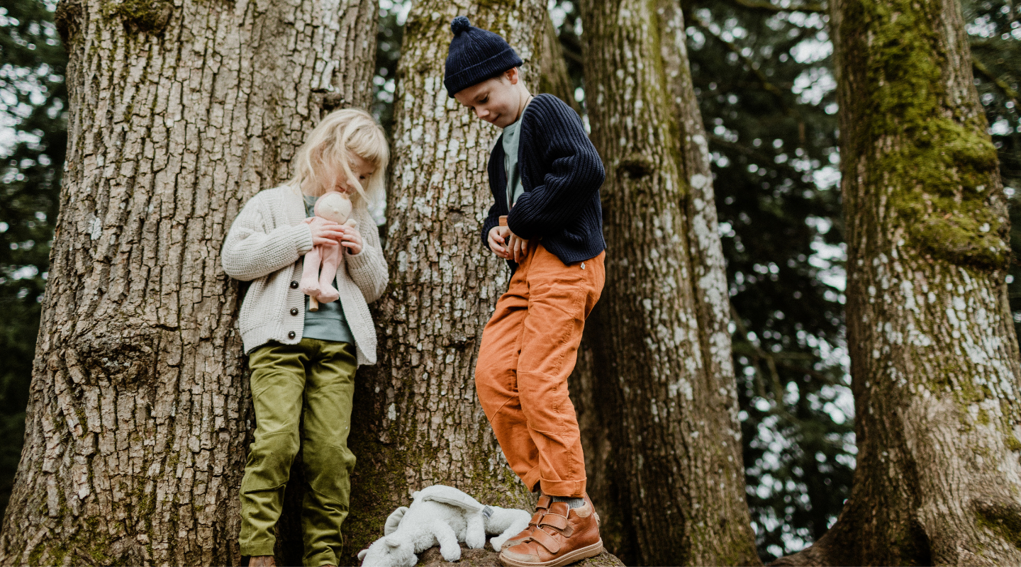 Kids wearing durable reinforced-knee pants climbing and playing actively