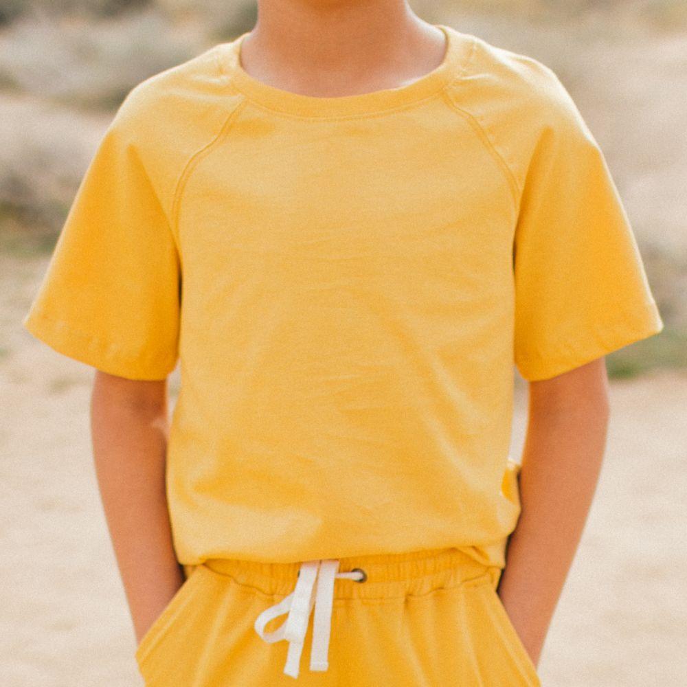 Boy in yellow shirt and shorts set