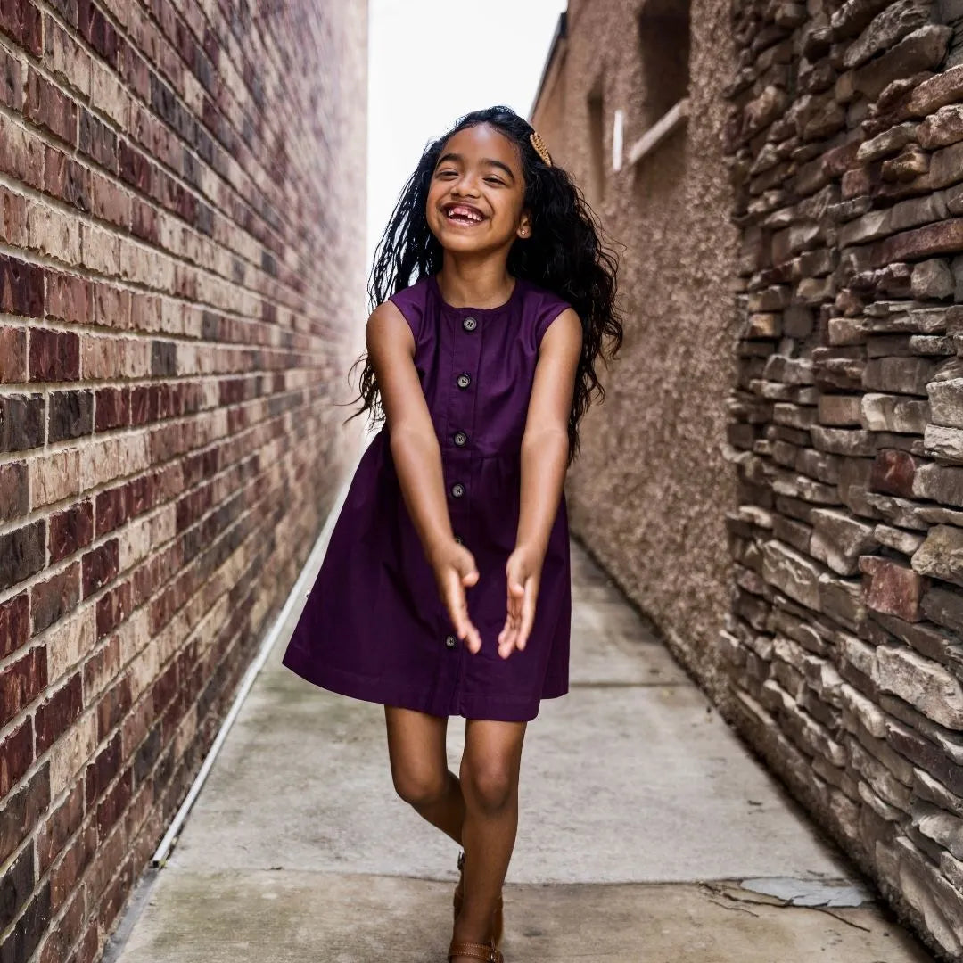 Child wearing Jackalo's Jo dress in Berry