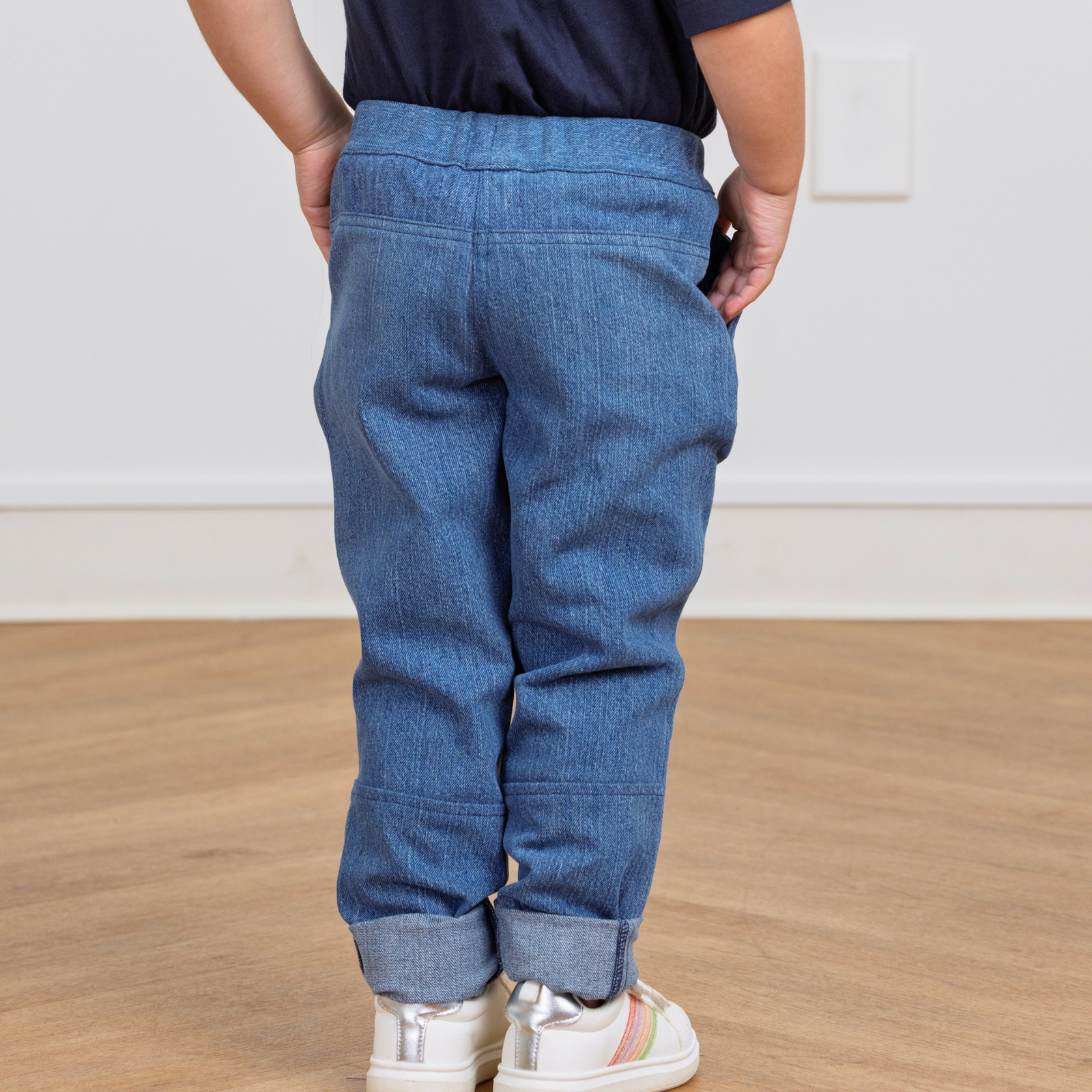 Kids' blue denim joggers with cuffed hems, perfect for active play and comfort.