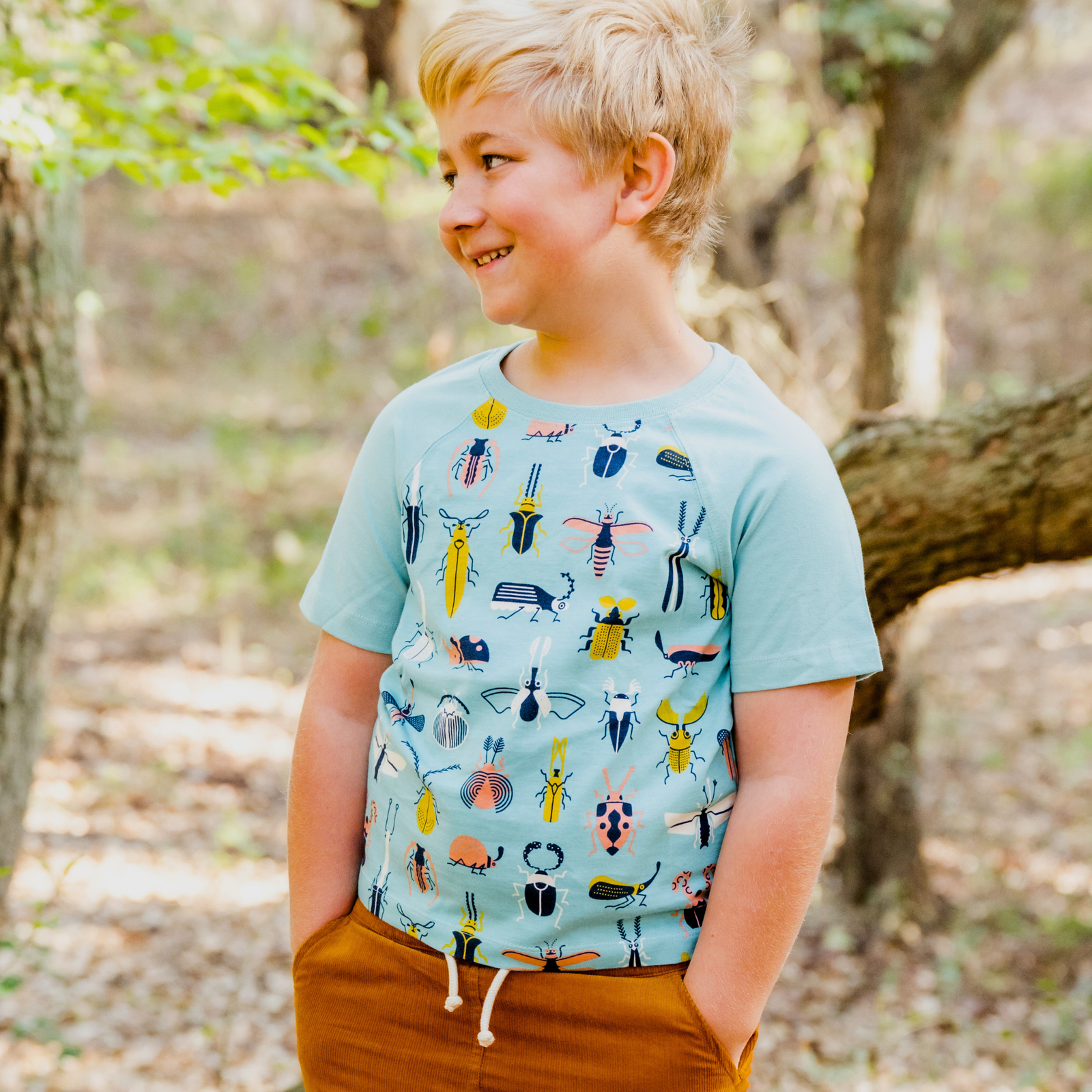 Kids' Jackalo blue t-shirt with colorful beetle and insect print, sustainable clothing