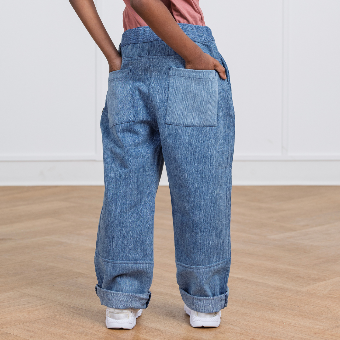 Kids' blue denim cargo pants with rolled cuffs and back pockets, perfect for active play