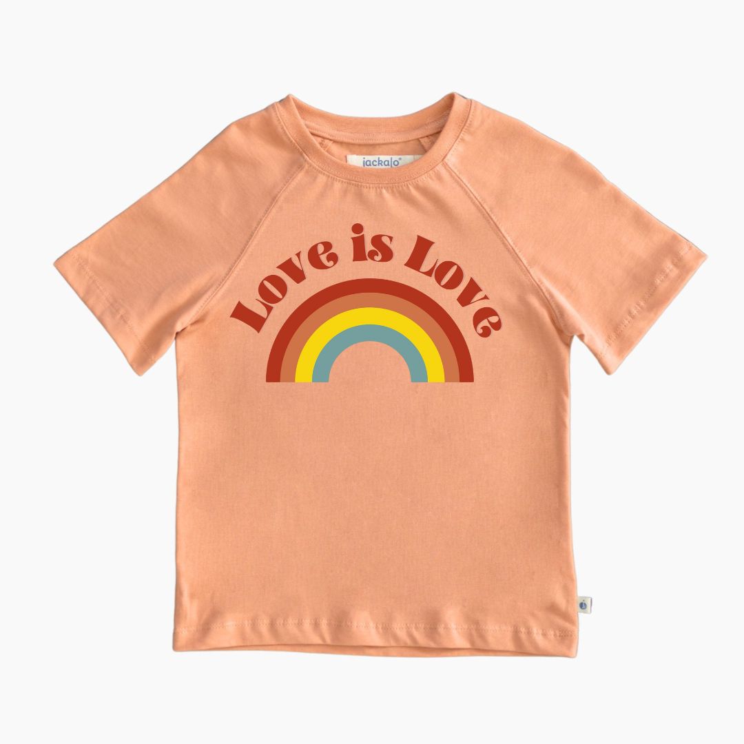 Organic peach-colored t-shirt with 'Love is Love' and rainbow graphic 