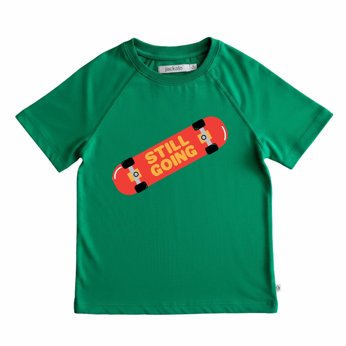 Red skateboard with "still going" graphic on green t-shirt