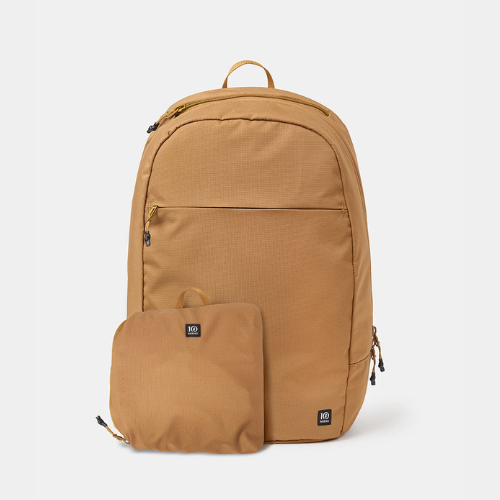 A tan backpack equipped with a small pocket