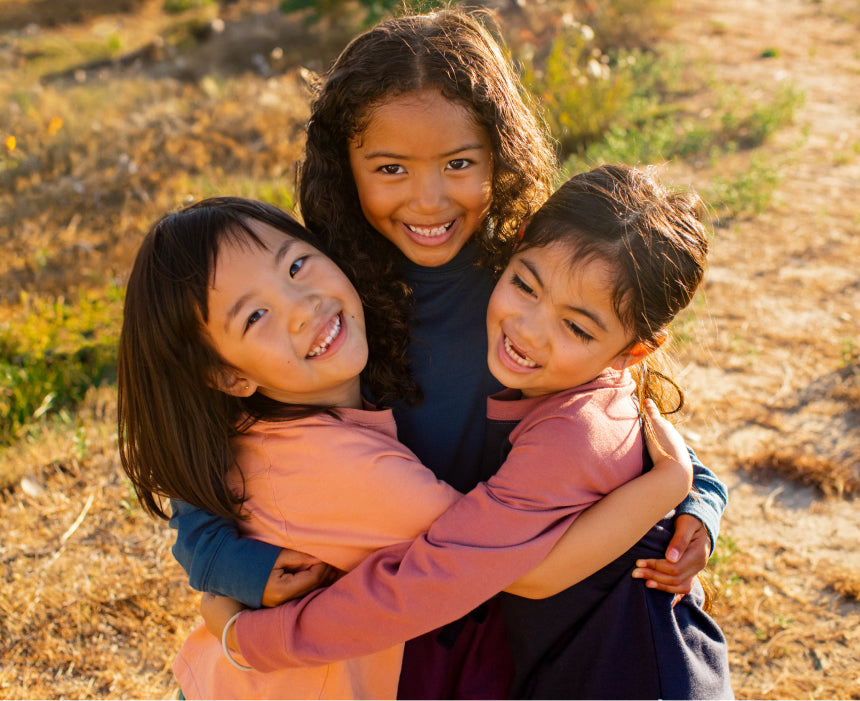 three kids hugging