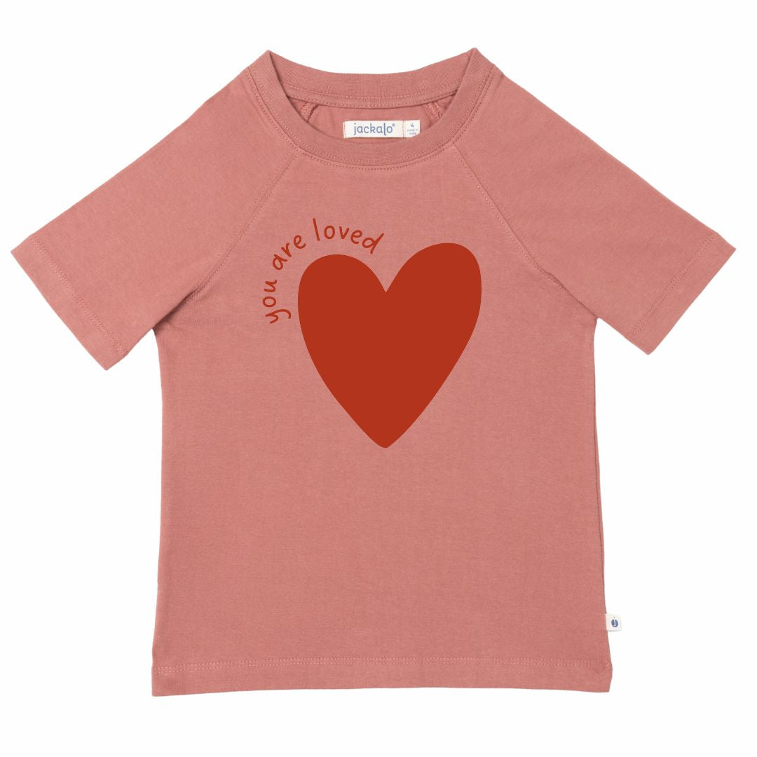 Organic pink t-shirt with a red heart and 'you are loved' text on a white background