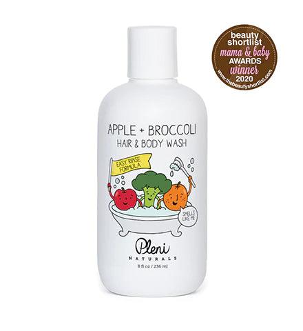 A bottle of body wash featuring a blend of apple and broccoli